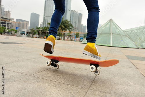  skateboarding woman jump at city
