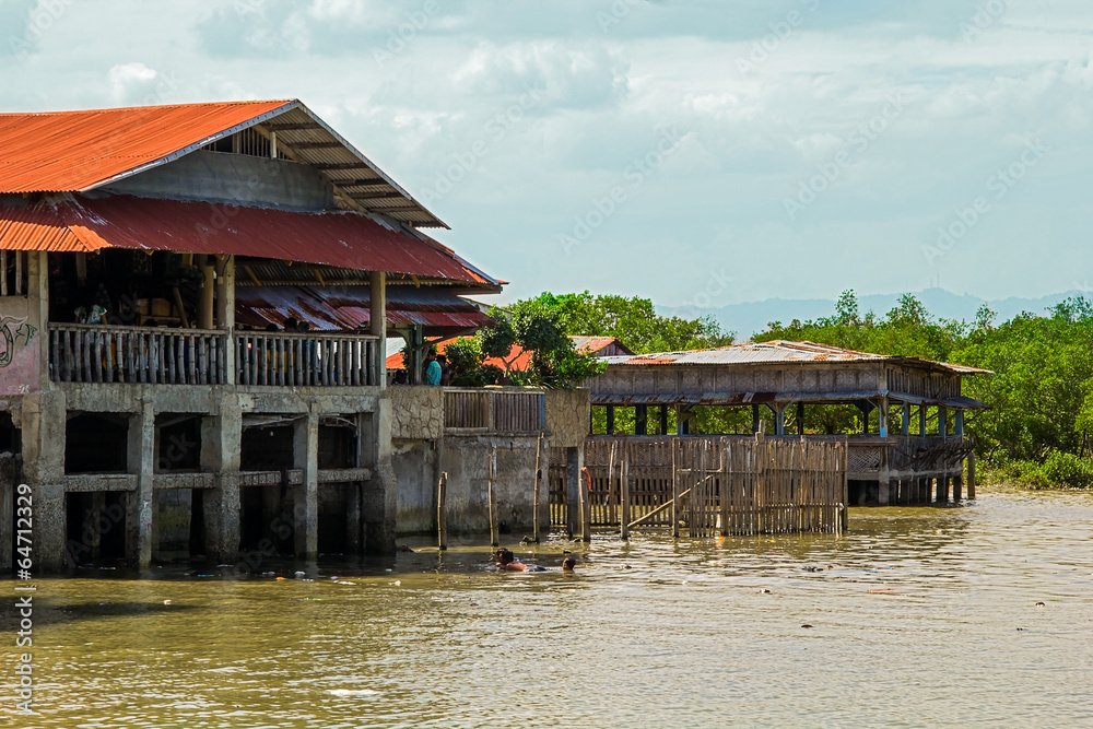 Stilted houses and the river, Philippines