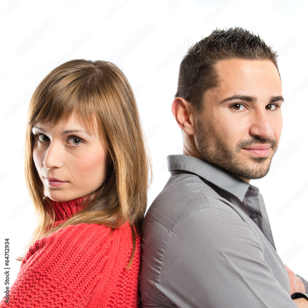 Couple with their arms crossed over isolated background Couple with their arms crossed over isolated background