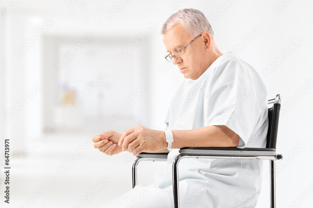 Worried mature patient sitting in a hospital corridor Worried mature patient sitting in a hospital corridor