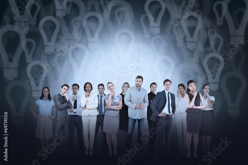 Business team against light bulb background