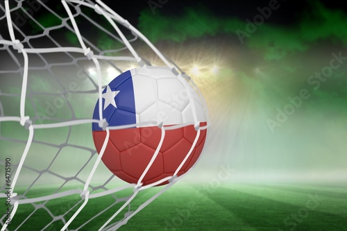 Football in chile colours at back of net