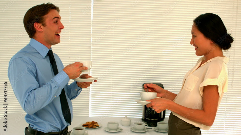Business people having coffee in the staff room Business people having coffee in the staff room