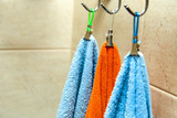 Three towels hanging on a hook