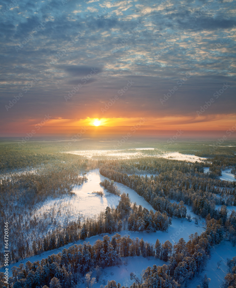 Top view of forest river at winter morning