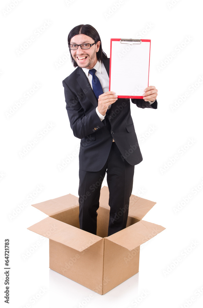 Young businessman in thinking out of box concept Young businessman in thinking out of box concept