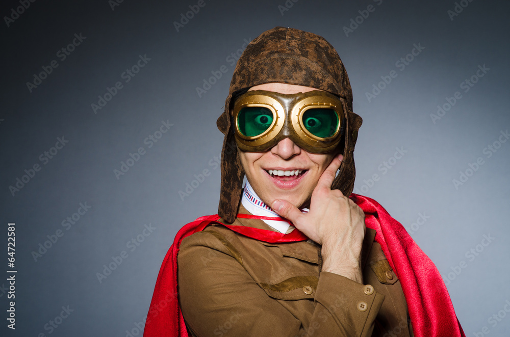Funny pilot with goggles and helmet