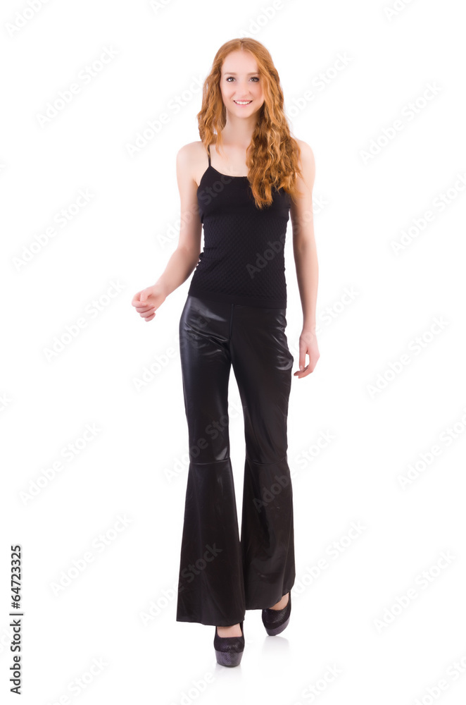 Redhead woman in black bell bottom pants on white Redhead woman in black bell bottom pants on white