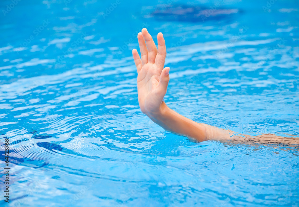 Hand of drowning person in the water. Help concept.