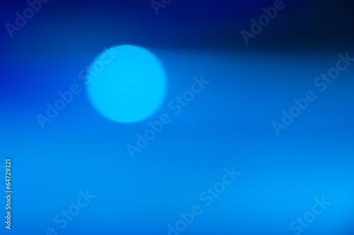 Blue abstract bokeh background with vertical stripes blurred