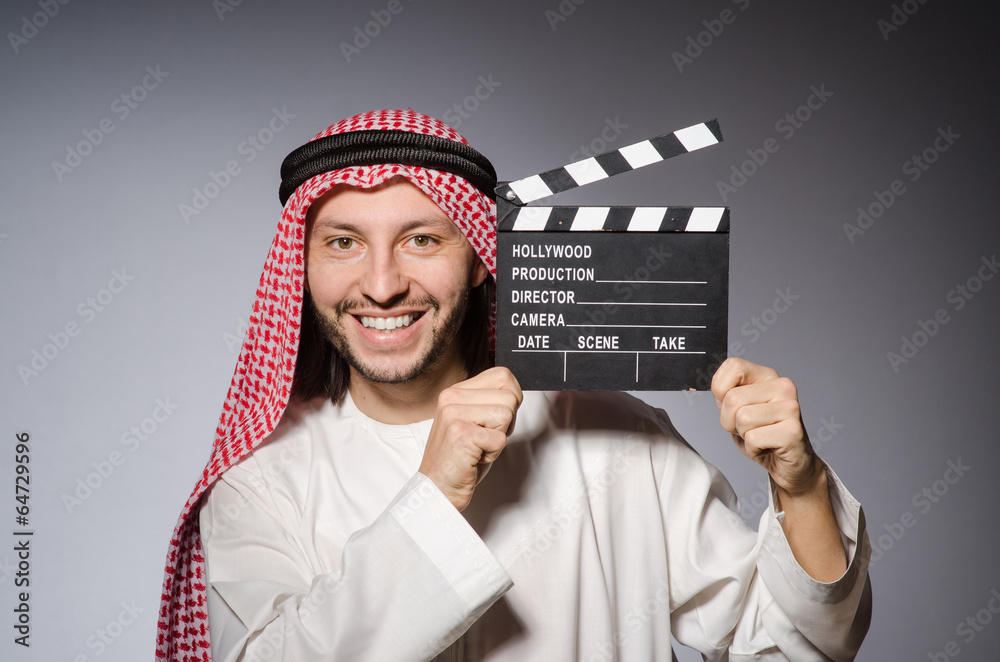 Arab with movie clapper board Arab with movie clapper board