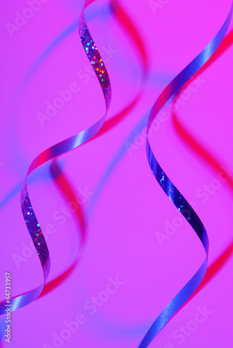 confetti serpentine ribbon on color background
