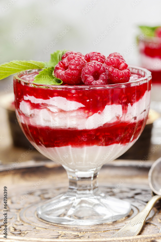 Raspberry layer dessert in glass bowl Raspberry layer dessert in glass bowl