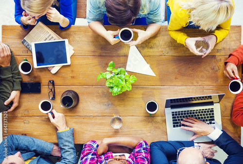 Multiethnic People with Startup Business Talking in a Cafe photo