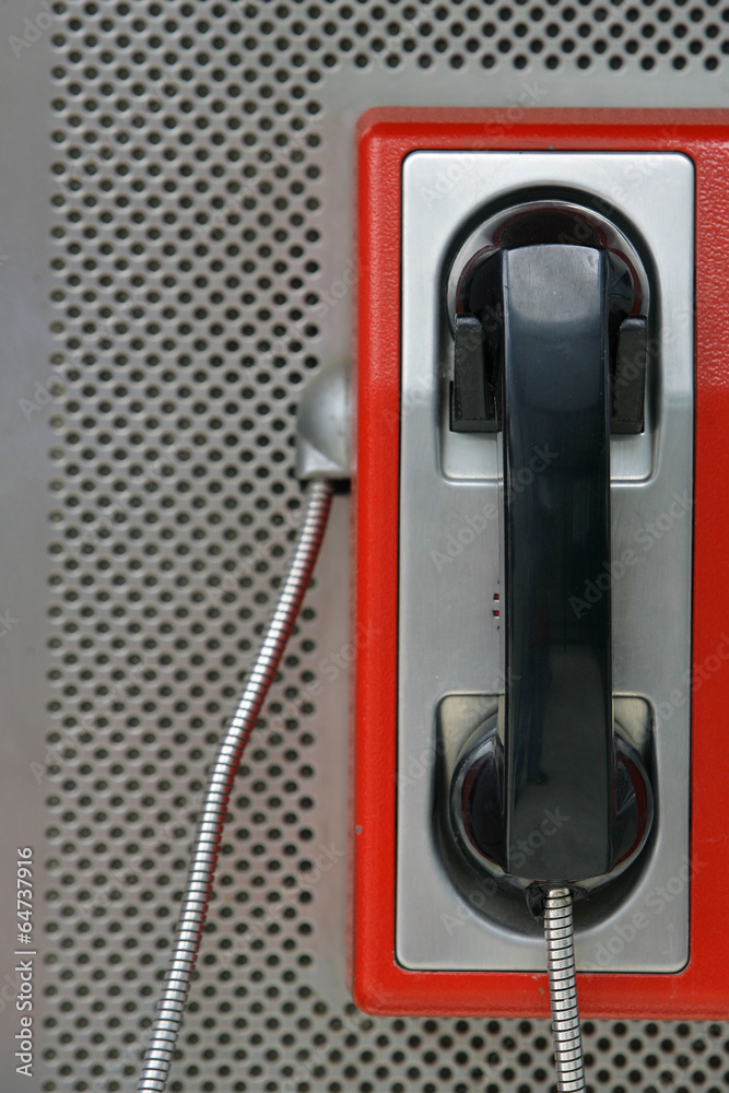 the public pay phone close up, phone and headset the public pay phone close up, phone and headset