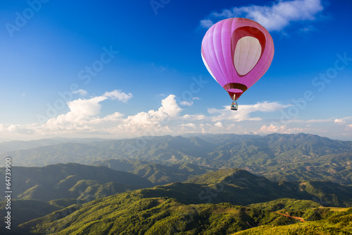 Hot air balloon over mountain