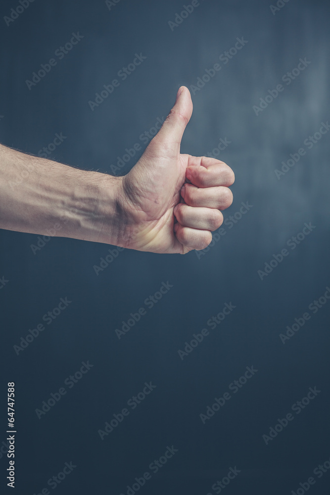 Hand giving thumb up