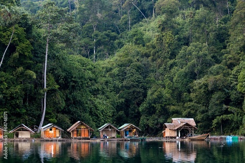 Bungalow on tropical lake photo