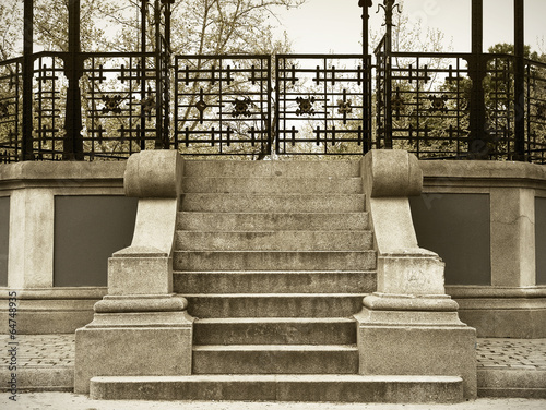 Obraz na płótnie Antique stone stair with metallic fence in sepia tone