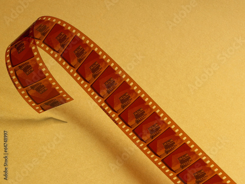 Valokuva Film celluloid over a yellow background