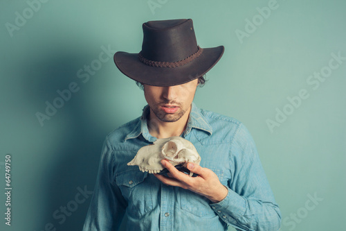 Cowboy with animal skull