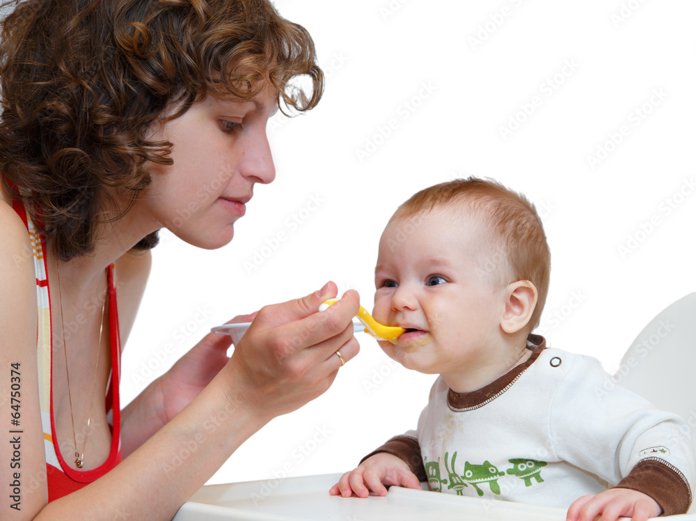 Mother spoon-feed her obedient baby Mother spoon-feed her obedient baby