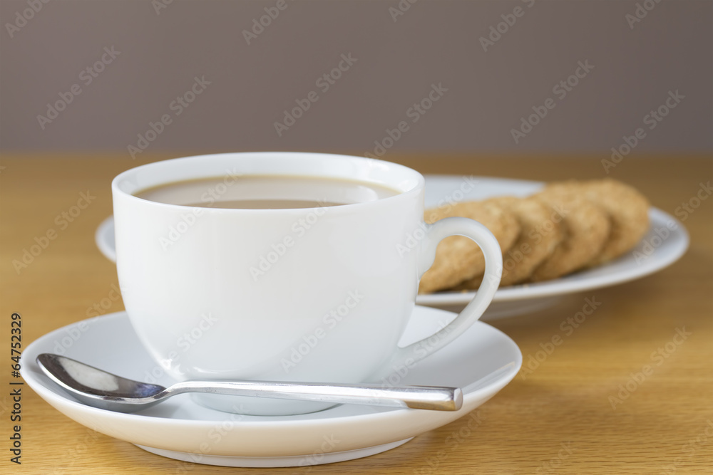 Fototapeta premium Cup of tea and biscuits on a table