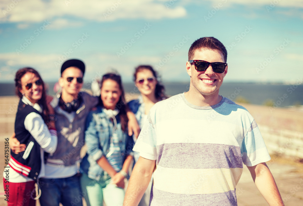 teenage boy with sunglasses and friends outside teenage boy with sunglasses and friends outside