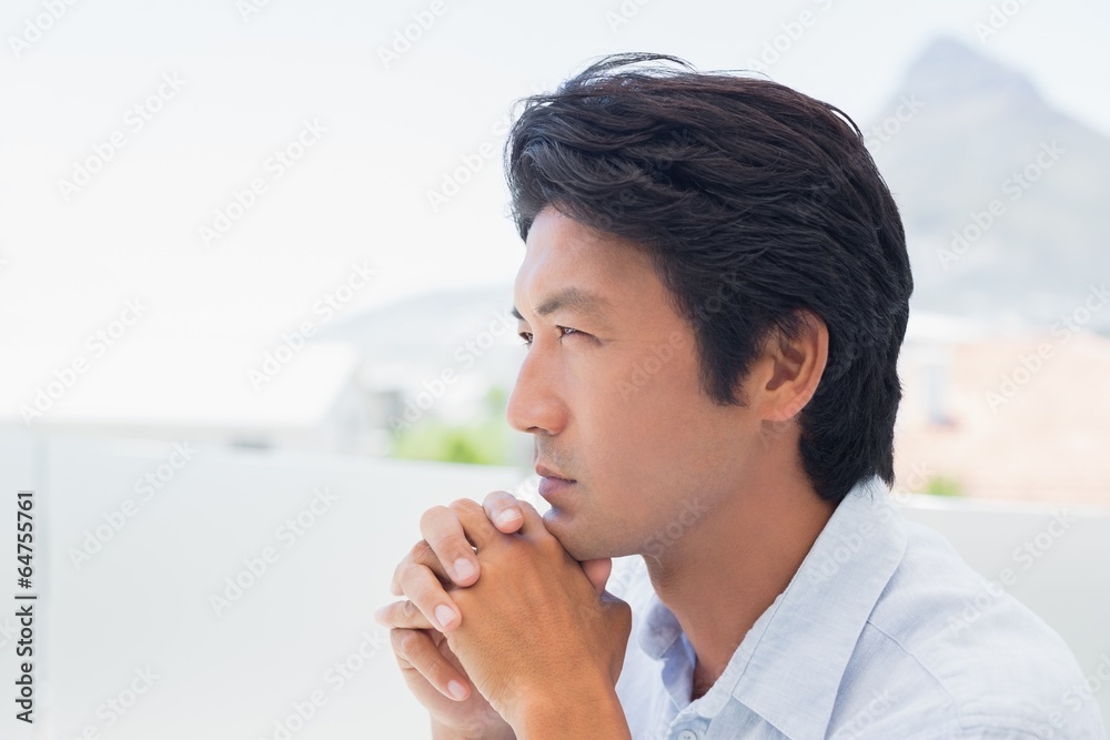 Fototapeta premium Thinking man with hands together