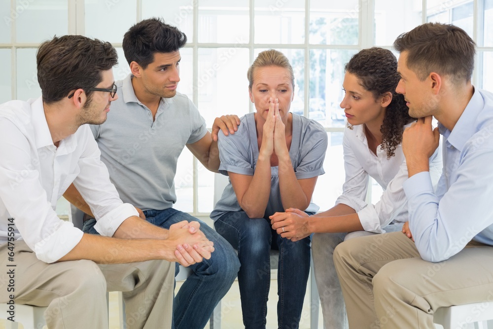 Group therapy in session sitting in a circle Group therapy in session sitting in a circle
