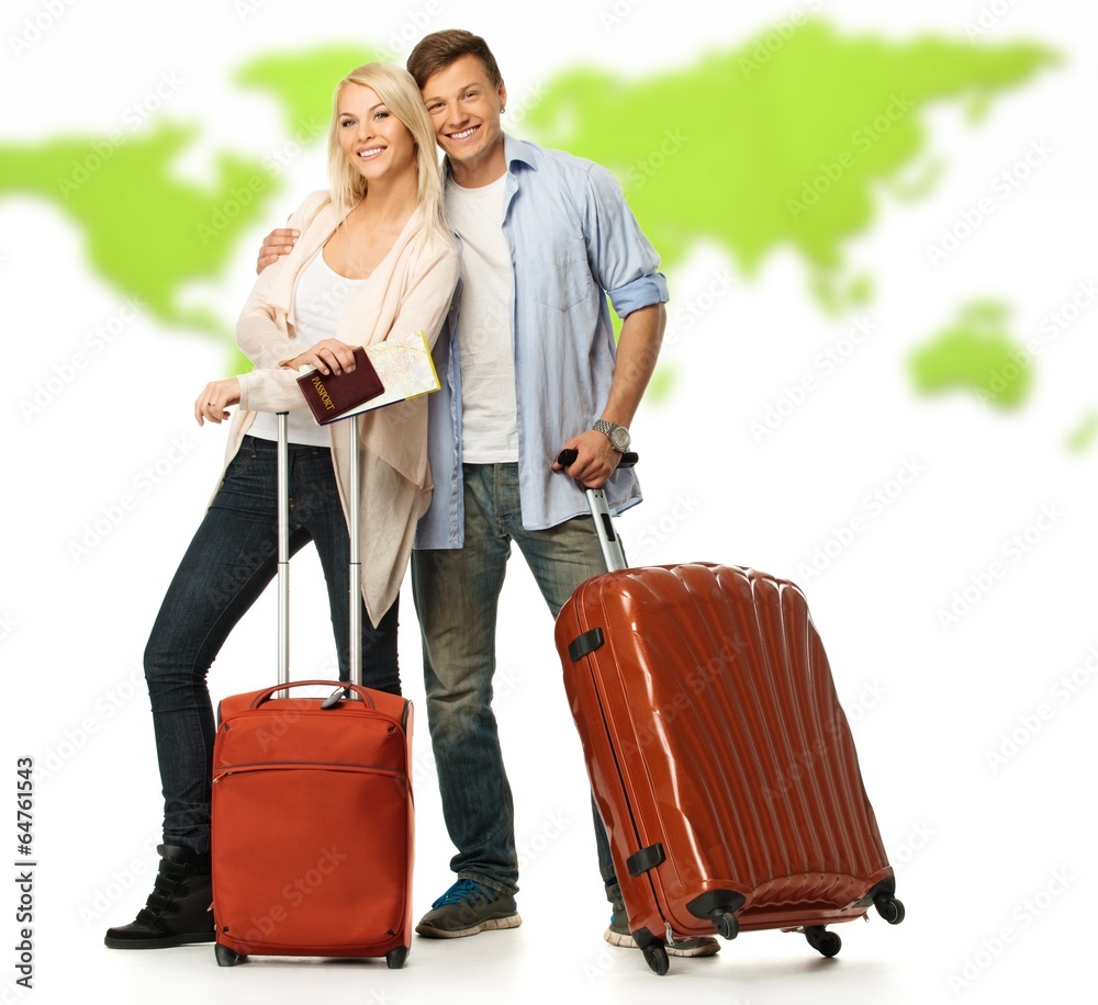 Happy couple with suitcases and documents against world map Happy couple with suitcases and documents against world map