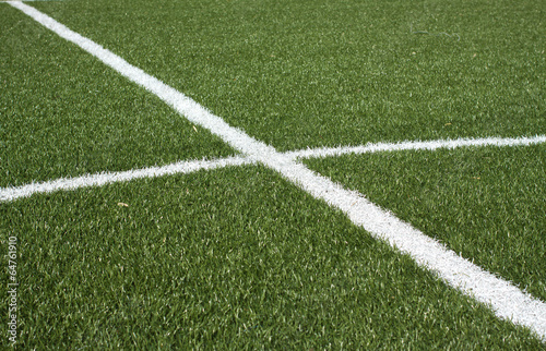 Center a soccer field with synthetic grass and white lines