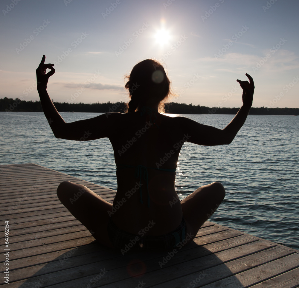 Silhouette of a woman practicing yoga at a pier, Georgian Bay, T