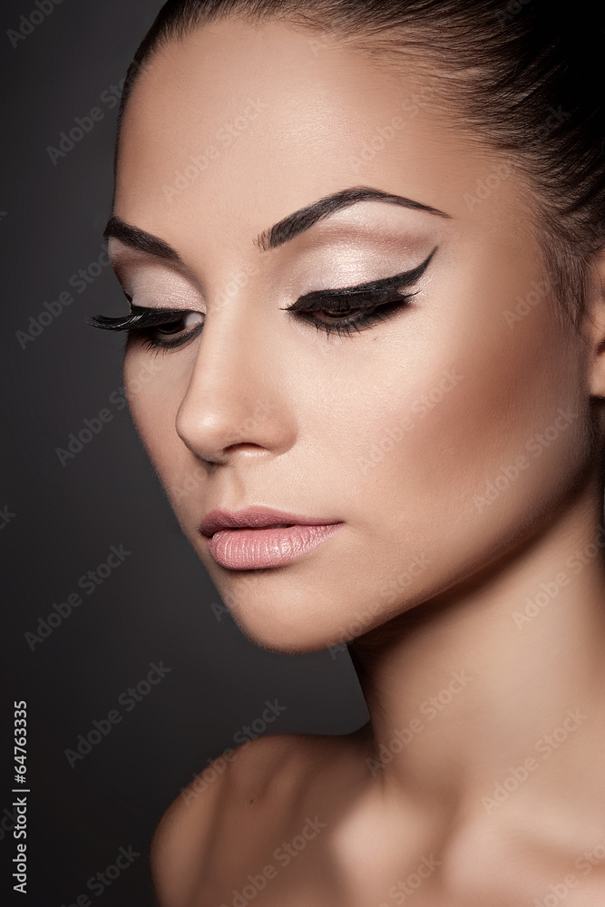 Closeup portrait of young beautiful woman with long eyelashes Closeup portrait of young beautiful woman with long eyelashes