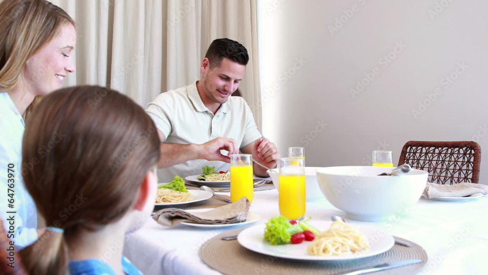 Happy young family at the dinner table Happy young family at the dinner table