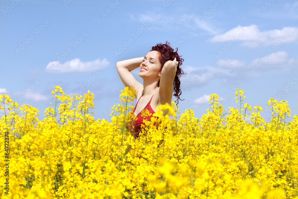 Woman enjoying in a rape field Woman enjoying in a rape field