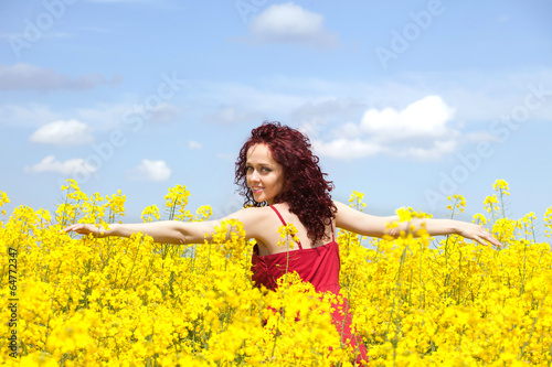 Woman enjoying in a rape field