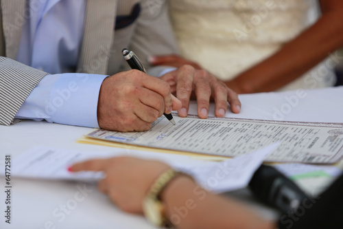 Signing marriage license photo