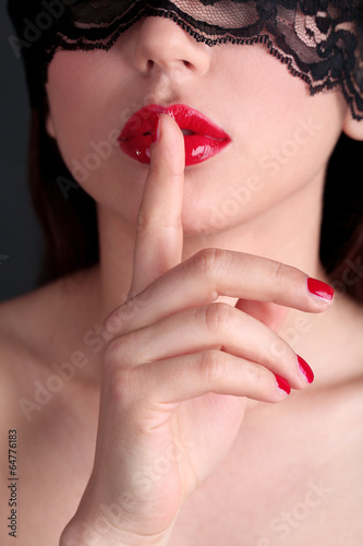 Girl with red lips, nails and openwork black eye