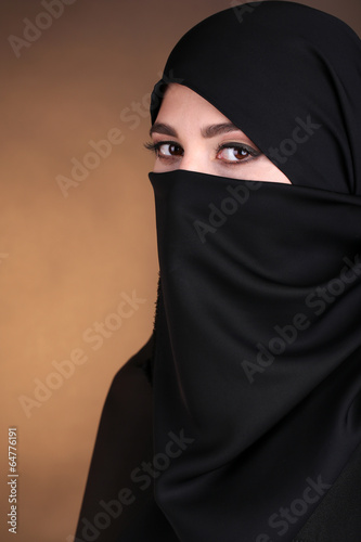Beautiful muslim arabic woman in paranja photo
