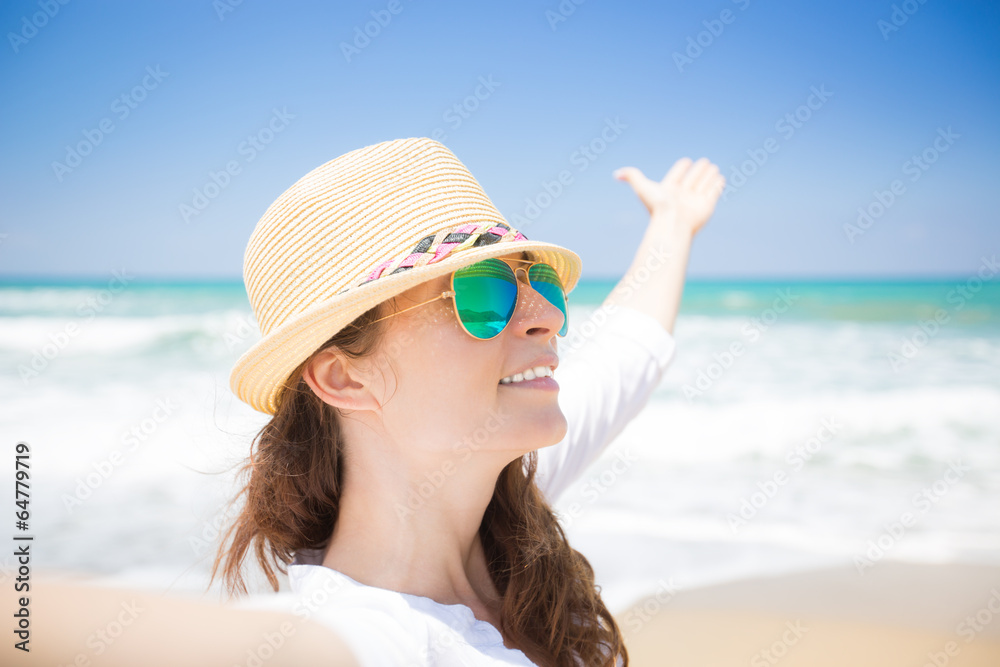 Happy woman enjoying life at the beach