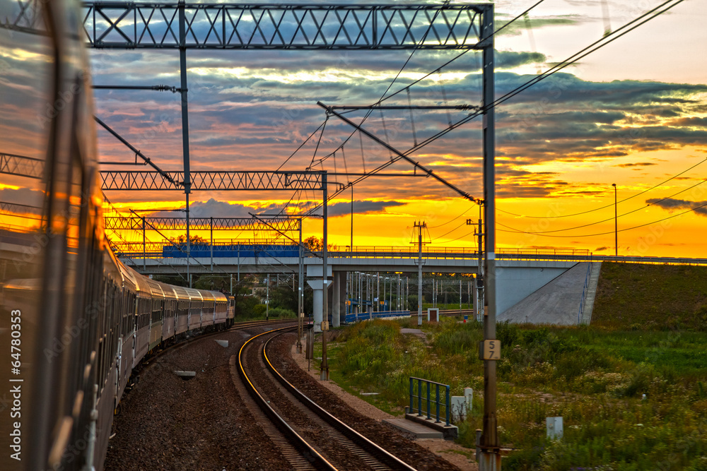 Naklejka premium Train at the sunset