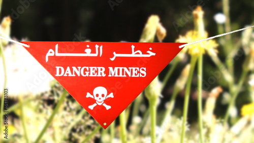 Warning sign in front of a minefield