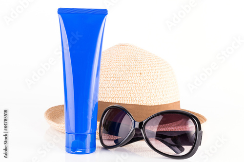 suntan cream, sunglasses and hat isolated on white