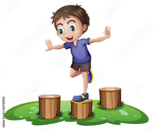 A young boy above the stump