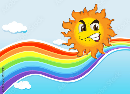A sky with a rainbow and an angry sun