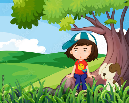 A young girl and her pet under the tree