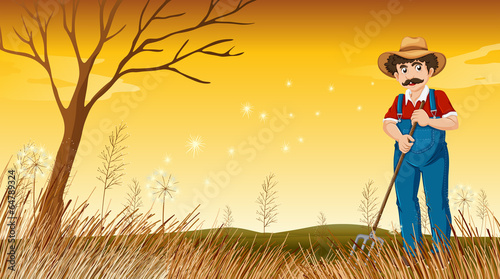 An old man raking the grass