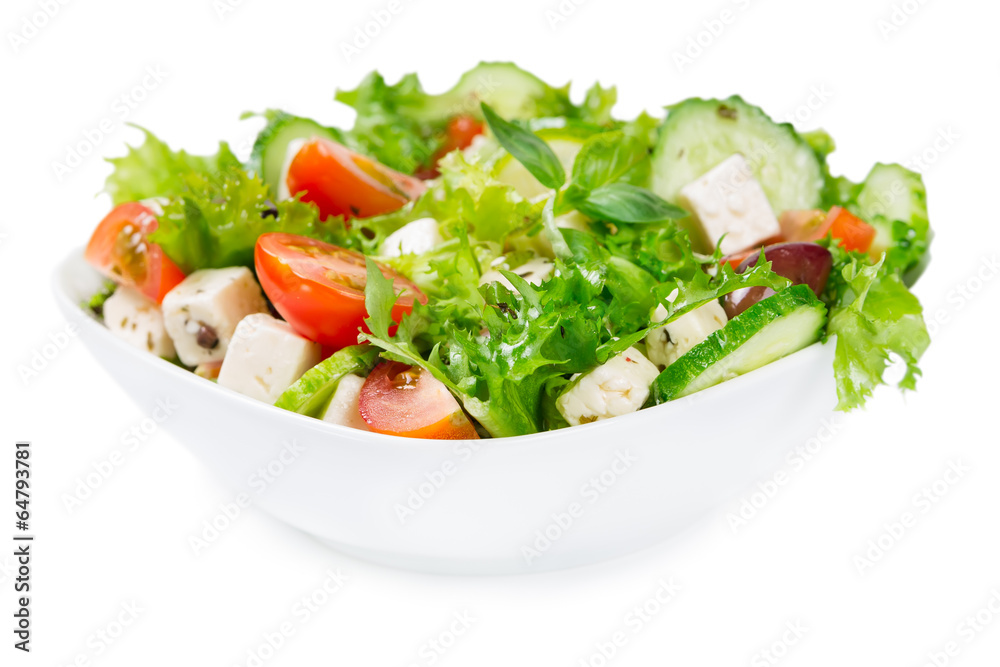 Salad with fresh vegetables in a ceramic bowl
