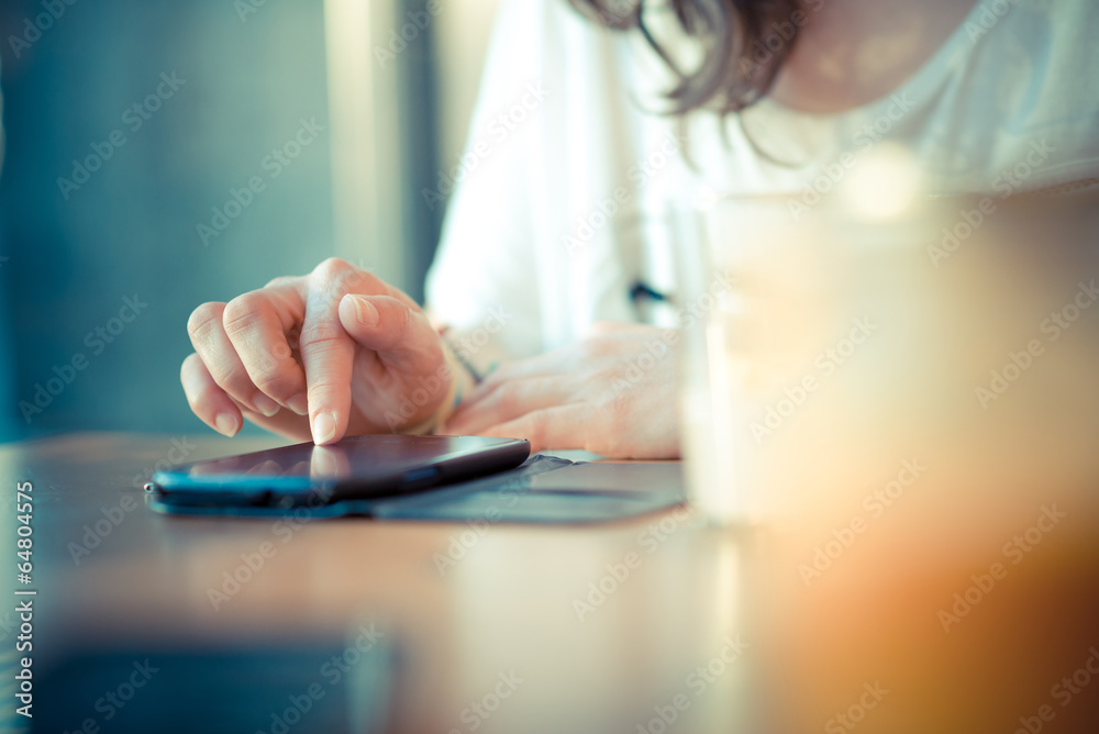 Fototapeta premium close up of woman hands using smart phone